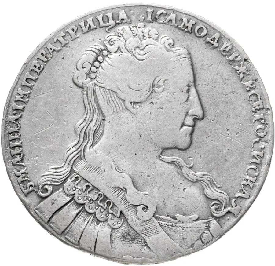 1 рубль 1734   тип 1734 года, голова меньше (переходный портрет), крест короны разделяет надпись, 5 жемчужин в волосах