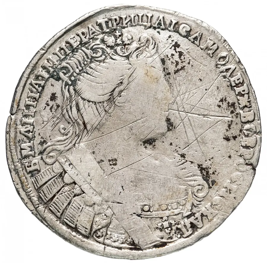 полтина 1733   голова больше, портрет смещен влево, крест державы простой